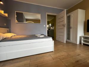 Posteľ alebo postele v izbe v ubytovaní Apartament MRĄGOWIA