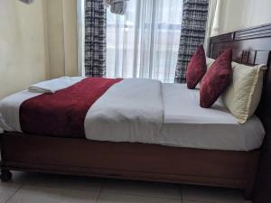 Postel nebo postele na pokoji v ubytování Epitome Times Hotel