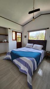 Postel nebo postele na pokoji v ubytování Casa de Campo El Trébol