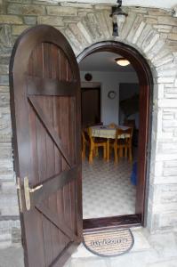 an entrance to a house with a wooden door at Elia Apartments Sithonia in Elia