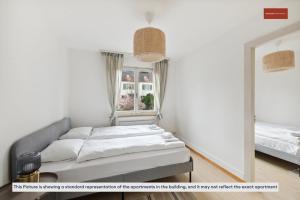 Uma cama ou camas num quarto em Cozy 3-Bedroom Apartment in Chreis45