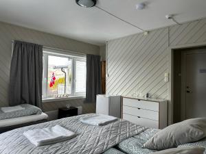 Postel nebo postele na pokoji v ubytování Storfossen Hostel