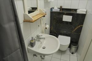 Koupelna v ubytování Bovino Hotel