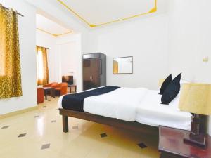 a bedroom with a large bed in a room at The Kunadi Heritage by Boho Stays in Jaipur