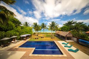 an aerial view of a resort with a swimming pool at Obi exclusive pousada in Ponta do Mangue