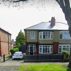 a house with a car parked in front of it at 3 bed home, pool-hot tub & ev charger in Darlington