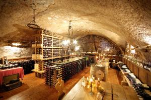 a wine cellar with a bunch of wine bottles at Schloss Hotel Korb in Appiano sulla Strada del Vino