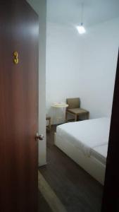 Postel nebo postele na pokoji v ubytování GG 98 Hotel