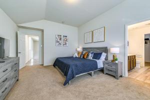 a bedroom with a bed and a flat screen tv at McKinney Home with Smart TV 10 Mi to Historic Dwtn! in Frisco