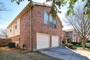 a brick house with a garage at McKinney Home with Smart TV 10 Mi to Historic Dwtn! in Frisco