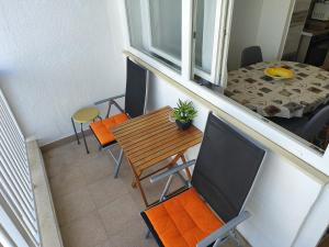 an overhead view of a balcony with a table and chairs at APARTMENT MARINA VIEW in Zadar
