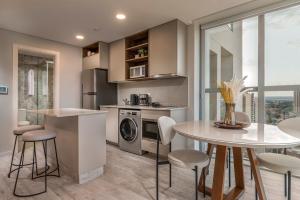 ครัวหรือมุมครัวของ ÚNICO - Stay & Residences by AVA