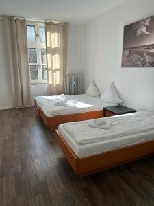 a room with two beds and a window at dreams Düsseldorf in Düsseldorf