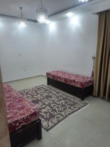 Voodi või voodid majutusasutuse Hasnaoui toas
