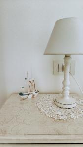 a lamp sitting on top of a table with a lampost at Alba b&b in Polignano a Mare