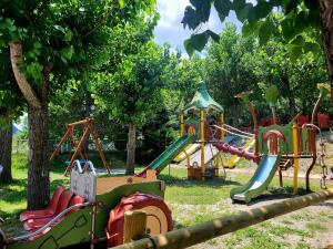 a group of playground equipment in a park at Aiguestortes Camping Resort in Esterri d'Àneu