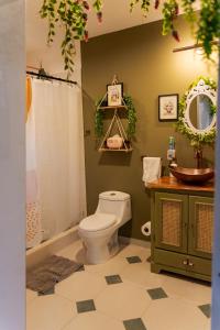 a bathroom with a toilet and a sink at Tiny Pines A-Frame Cabin, Domes and Luxury Glamping Site 