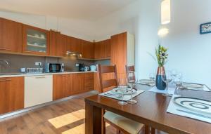 a kitchen with a wooden table with wine glasses at Apartment Valeria Vabriga in Vabriga