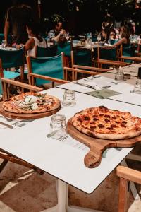 two pizzas sitting on top of a table at Toison D'or in Saint-Tropez