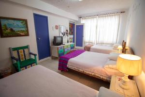 Postelja oz. postelje v sobi nastanitve Sakti Hostal B&B