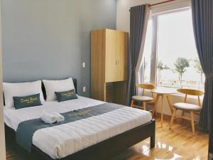 Ένα ή περισσότερα κρεβάτια σε δωμάτιο στο DanaBeach Motel