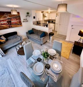 a living room with a glass table and chairs at Birmingham Bliss Central 5-Bed Escape in Birmingham