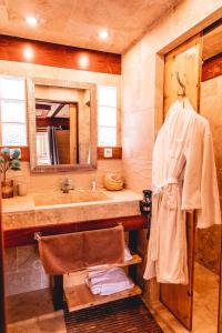 a bathroom with a sink and a mirror at Toison D'or in Saint-Tropez