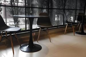 a table and chairs in front of a window at Studio Vila Prudente - Metrô linha verde in São Paulo