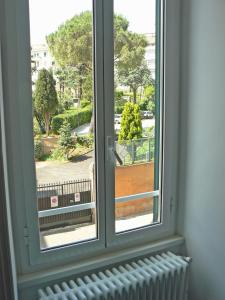 a window with a view of a park at B&b Il Sampietrino Dei Cavalleggeri in Rome