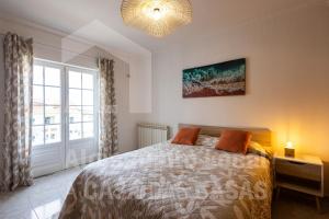 Ένα ή περισσότερα κρεβάτια σε δωμάτιο στο Casa Sardine by ACasaDasCasas