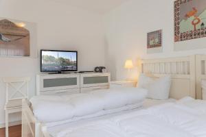 Ένα ή περισσότερα κρεβάτια σε δωμάτιο στο Haus Harle 50204 Ferienwohnung Harle 3 +5 φωτογραφίες