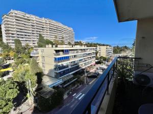 a view of a large building from a balcony at La Pépinière in Cannes