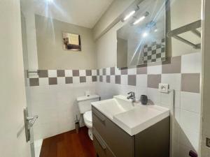 a bathroom with a sink and a toilet at La Pépinière in Cannes