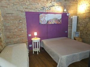 Postel nebo postele na pokoji v ubytování Bella Toscana
