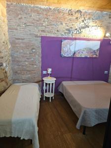 Postel nebo postele na pokoji v ubytování Bella Toscana