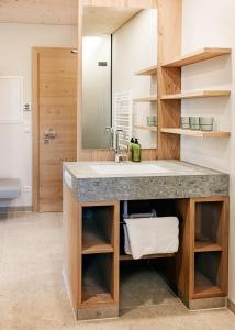 a bathroom with a sink and a mirror at Ferienhof Reiterhof Edtbauer in Weyer Markt