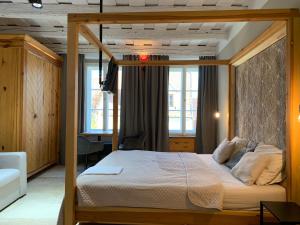 Postel nebo postele na pokoji v ubytování Hotel Desatero