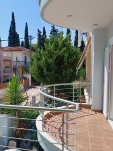 a balcony with a view of a garden at LIGEIA HOME in Nafplio