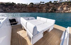 a boat with a couch on the deck on the water at PARDO YACHT 38 in Saint-Laurent-du-Var