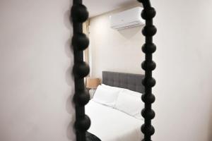 a bedroom with a bed with white pillows at For You Rentals Espléndido Apartamento de tres Dormitorios BEI41 in Madrid