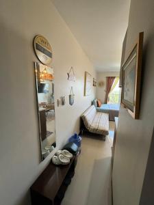 a living room with a couch and a mirror at LBS Condo Rental-Full Relaxing Seaview 304-10Flr in Lapu Lapu City