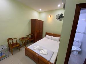 Ένα ή περισσότερα κρεβάτια σε δωμάτιο στο Hotel Bình An