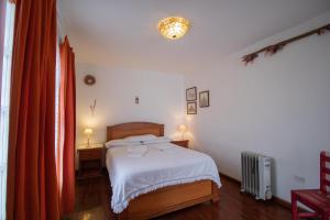 Postelja oz. postelje v sobi nastanitve Sakti Hostal B&B