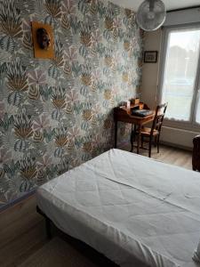 Posteľ alebo postele v izbe v ubytovaní L'Intemporel - Appartement T3 avec jardinet