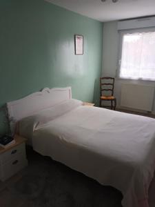 Posteľ alebo postele v izbe v ubytovaní L'Intemporel - Appartement T3 avec jardinet