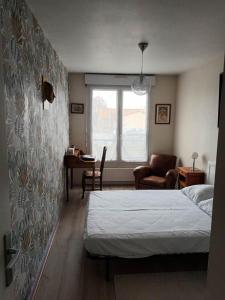 Posteľ alebo postele v izbe v ubytovaní L'Intemporel - Appartement T3 avec jardinet