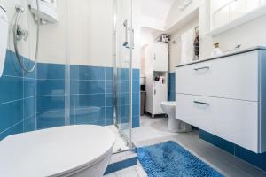a bathroom with a toilet and a shower at Casa di Cecilia in Castellammare del Golfo