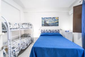a bedroom with a bed and a bunk bed at Casa di Cecilia in Castellammare del Golfo +24 photos