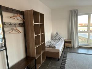 Ένα ή περισσότερα κρεβάτια σε δωμάτιο στο Pension Boardinghaus Dingolfing