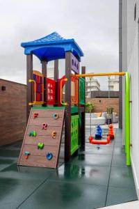 a childrens play area with a playground at Brava Mundo Hotel Boutique in Itajaí